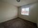 Bright bedroom with carpet flooring and a large window at 2104 Fountain View Dr, Las Vegas, NV 89134