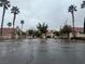 Residential community entrance with palm trees and signage at 2104 Fountain View Dr, Las Vegas, NV 89134