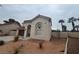 One-story house with brown garage door and desert landscaping at 2104 Fountain View Dr, Las Vegas, NV 89134