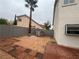 Landscaped side yard with block wall and pathway at 2104 Fountain View Dr, Las Vegas, NV 89134