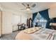 Bedroom with a queen-size bed, a desk, and sliding closet doors at 2137 Willowbury Dr # B, Las Vegas, NV 89108