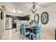 Bright dining area with a small table and four teal chairs at 2137 Willowbury Dr # B, Las Vegas, NV 89108