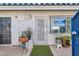 Front door entrance with potted plants and a decorative gate at 2137 Willowbury Dr # B, Las Vegas, NV 89108