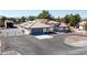 Single story home with solar panels and circular driveway at 2250 Xenia Ave, Pahrump, NV 89048