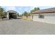 Gravel and grass backyard with covered structure and shed at 2250 Xenia Ave, Pahrump, NV 89048