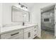 Modern bathroom with gray tile shower and white vanity at 2250 Xenia Ave, Pahrump, NV 89048