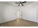 Bright bedroom with ceiling fan and access to hallway at 2250 Xenia Ave, Pahrump, NV 89048