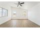 Well-lit bedroom with two windows and wood flooring at 2250 Xenia Ave, Pahrump, NV 89048