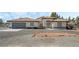 Single-story home with tile roof, attached garage, and landscaped front yard at 2250 Xenia Ave, Pahrump, NV 89048