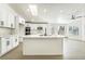 Modern kitchen with white cabinets, quartz countertops, and island at 2250 Xenia Ave, Pahrump, NV 89048