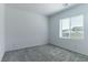 Bright bedroom with grey carpet and window coverings at 230 Palisade Falls Ave, Henderson, NV 89015