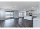 Bright living room with sliding glass doors leading to backyard at 230 Palisade Falls Ave, Henderson, NV 89015