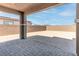 Covered patio with brick pavers and view of backyard at 230 Palisade Falls Ave, Henderson, NV 89015