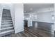 Modern staircase with gray carpeting and kitchen view at 230 Palisade Falls Ave, Henderson, NV 89015