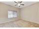 Well-lit bedroom with ceiling fan and window coverings at 2452 Sunup Dr, Las Vegas, NV 89134