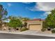 Single story home with two car garage and nicely landscaped front yard at 2452 Sunup Dr, Las Vegas, NV 89134