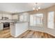 Modern kitchen with island, stainless steel appliances, and breakfast bar at 2452 Sunup Dr, Las Vegas, NV 89134