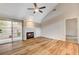 Spacious living room featuring a fireplace and sliding door to patio at 2452 Sunup Dr, Las Vegas, NV 89134