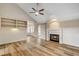 Living room with vaulted ceiling, fireplace, and built-in shelving at 2452 Sunup Dr, Las Vegas, NV 89134