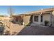 Backyard view of home with covered patio and landscaping at 3109 Siena Cir, Las Vegas, NV 89128