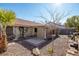 Backyard with gravel, plants, and covered patio at 3109 Siena Cir, Las Vegas, NV 89128