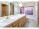 Bathroom boasts double vanity, a bathtub, and a separate shower at 3109 Siena Cir, Las Vegas, NV 89128