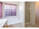 Clean bathroom with bathtub and shower combo at 3109 Siena Cir, Las Vegas, NV 89128