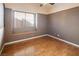 Bright bedroom with wood-look floors and window seat at 3109 Siena Cir, Las Vegas, NV 89128