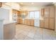 Bright kitchen with ample wood cabinets, tile floors, and modern appliances at 3109 Siena Cir, Las Vegas, NV 89128