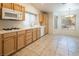 Inviting kitchen featuring wood cabinets, tile flooring, and a breakfast nook at 3109 Siena Cir, Las Vegas, NV 89128