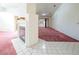 Open living room with corner fireplace and view to kitchen at 3109 Siena Cir, Las Vegas, NV 89128