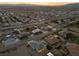 Aerial view of a single-Gathering home at sunset, showcasing the surrounding neighborhood at 311 Belfast St, Henderson, NV 89015