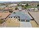 Aerial view of a single-Gathering home with a gray roof and a two-car garage at 311 Belfast St, Henderson, NV 89015