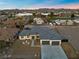 Aerial view of a single-story house with a two-car garage at 311 Belfast St, Henderson, NV 89015