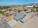 Aerial view of a single-Gathering home with a gray roof and a two-car garage at 311 Belfast St, Henderson, NV 89015