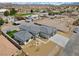 Aerial view of a single-Gathering home with a gray roof and a two-car garage at 311 Belfast St, Henderson, NV 89015