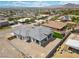 Aerial view of the back of a single-Gathering home with a gray roof and a covered patio at 311 Belfast St, Henderson, NV 89015