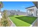 Artificial turf backyard, trampoline, and patio furniture at 311 Belfast St, Henderson, NV 89015