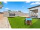 Large backyard with artificial turf, trampoline, and playset at 311 Belfast St, Henderson, NV 89015