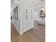 Bright bathroom with white cabinets and wood-look floors at 311 Belfast St, Henderson, NV 89015