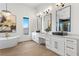 Luxurious bathroom with double vanity and freestanding tub at 311 Belfast St, Henderson, NV 89015