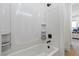 Bathroom with a shower/tub combo and built-in shelves at 311 Belfast St, Henderson, NV 89015