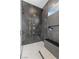 Spa-like bathroom with large shower, marble tile, and gold fixtures at 311 Belfast St, Henderson, NV 89015