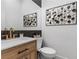 Powder room with vanity and decorative wall art at 311 Belfast St, Henderson, NV 89015