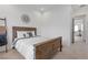 Bright bedroom with wood bed frame and ensuite bathroom at 311 Belfast St, Henderson, NV 89015