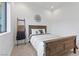 Charming bedroom with a wood bed frame and neutral decor at 311 Belfast St, Henderson, NV 89015