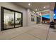 Covered patio with glass doors leading to the main bedroom and outdoor seating at 311 Belfast St, Henderson, NV 89015