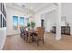 Bright dining room with large windows and wood table at 311 Belfast St, Henderson, NV 89015