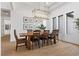 Formal dining room with a rustic wood table and chandelier at 311 Belfast St, Henderson, NV 89015