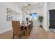 Bright dining room featuring a long wooden table and stylish decor at 311 Belfast St, Henderson, NV 89015